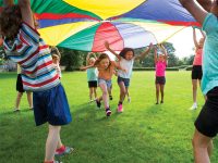 kids parachute game at birthday party outdoor party entertainment